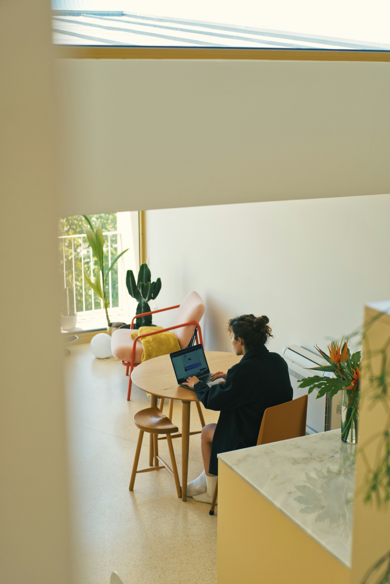 A radiologist working on a laptop at home